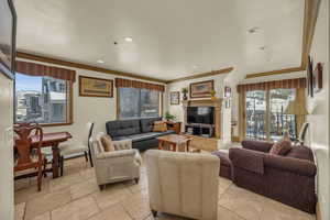 Living room featuring crown molding