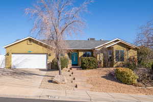 Single story home with a garage