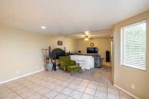 Bedroom featuring ceiling fan and light tile patterned floors