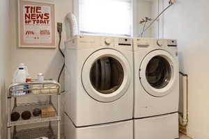 Laundry room featuring washer and clothes dryer