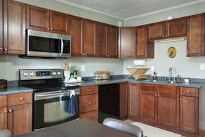 Beautiful kitchen with dining space and beautiful molding throughout