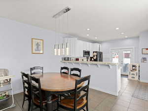 Tiled dining area with french doors