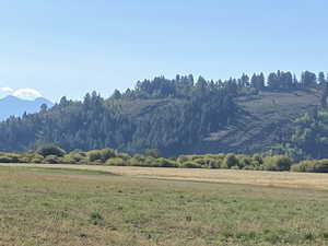 Property view of mountains with a rural view