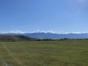 Property view of mountains with a rural view