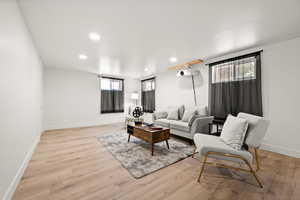 Living room with light wood-type flooring