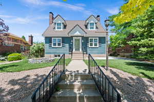 View of front of property with a front yard