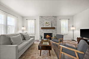 Living room featuring plenty of natural light and hardwood / wood-style flooring