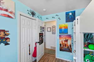 Interior space featuring dark wood-type flooring and a closet