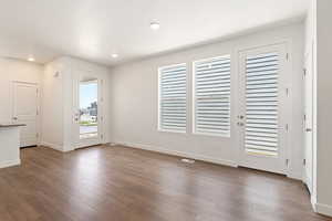 Interior space featuring dark hardwood / wood-style flooring