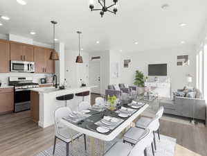 Dining room with light hardwood / wood-style floors