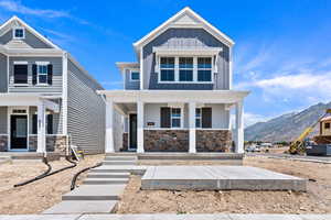 Craftsman house with a porch and a mountain view