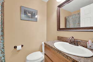 Bathroom featuring toilet and vanity