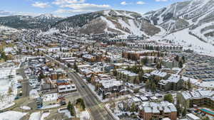 Snowy aerial view featuring a mountain view