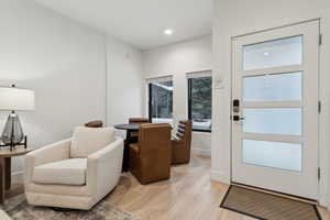 Foyer entrance with light hardwood / wood-style floors