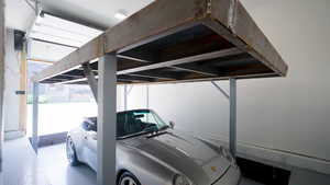 View of parking with a carport