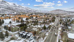 Snowy aerial view featuring a mountain view