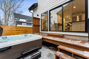 View of patio featuring a hot tub