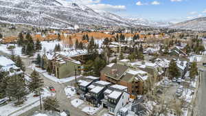 Snowy aerial view featuring a mountain view