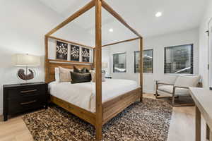 Bedroom with light hardwood / wood-style flooring