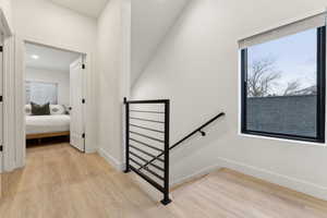 Stairs with hardwood / wood-style flooring