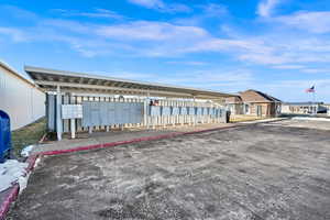 View of patio featuring mail boxes