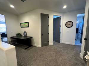 View of carpeted home office