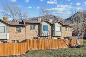 Exterior space featuring a mountain view and a yard