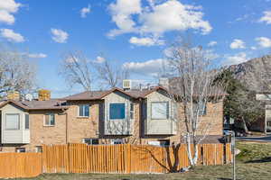 Exterior space featuring a mountain view and a yard