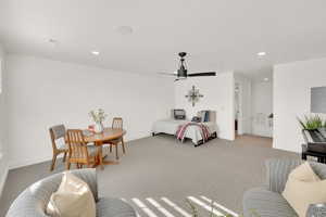 Bedroom featuring ceiling fan and light carpet