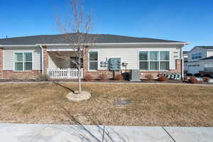 View of front of home featuring a front lawn