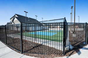 Exterior space featuring tennis court