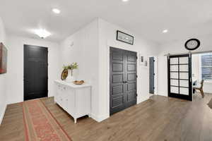 Entryway featuring hardwood / wood-style flooring and a barn door