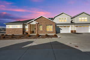 Craftsman house featuring a garage