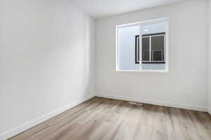 Spare room featuring light hardwood / wood-style floors