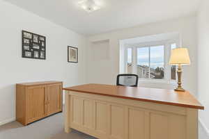 Third bedroom upstairs with baseboards and light carpet