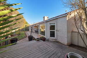 Wooden deck featuring a patio area