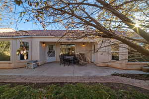 Rear view of house featuring a patio