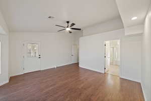 Empty room with ceiling fan and hardwood / wood-style floors