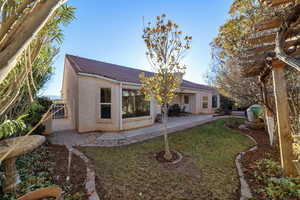 Rear view of house with a patio