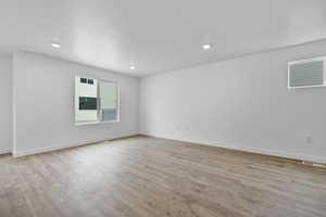 Unfurnished room with light hardwood / wood-style floors