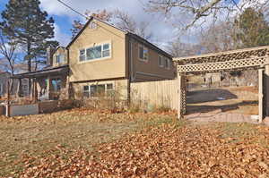 View of property exterior featuring a porch