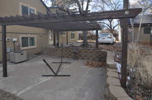 View of patio / terrace with a pergola and central air condition unit