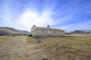 Rear view of property featuring a mountain view