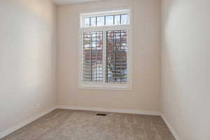 View of carpeted spare room