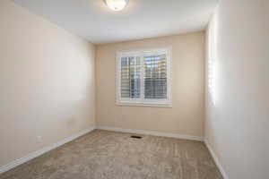 View of carpeted spare room