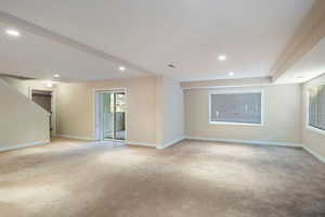 Spare room with light colored carpet