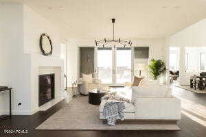 Living room with hardwood / wood-style flooring and lofted ceiling