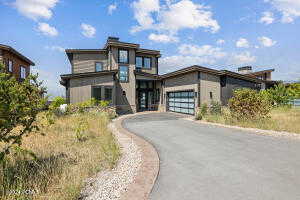 View of front facade featuring a garage