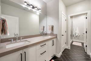 Bathroom featuring vanity and tile patterned flooring