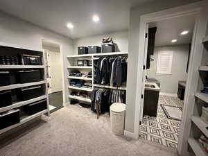 Spacious closet with carpet floors